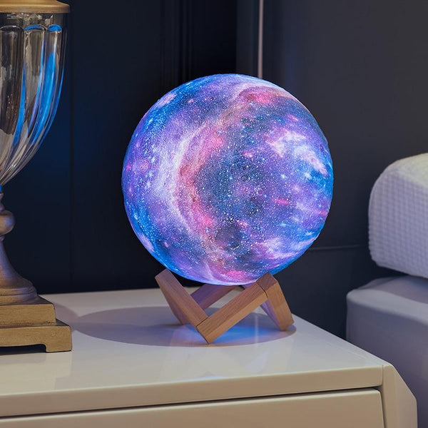 Very small blue galaxy lamp with wooden stand